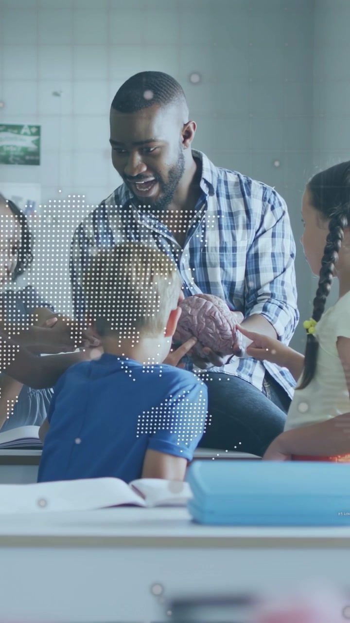 Vertical video: Teacher turning brain model guiding kids hands, dotted map or code overlaying teachi