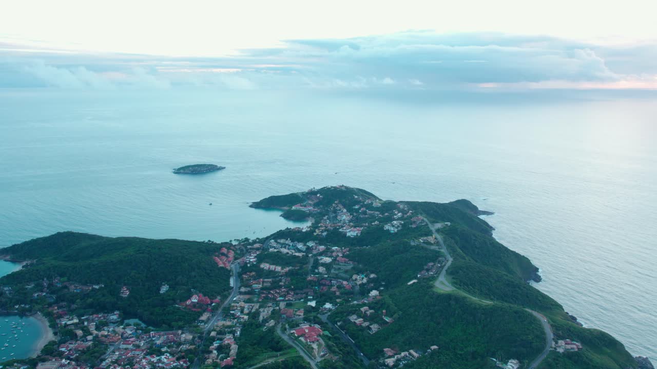 Aerial establishing shot of B&uacute;zios peninsula, Brazil at dawn