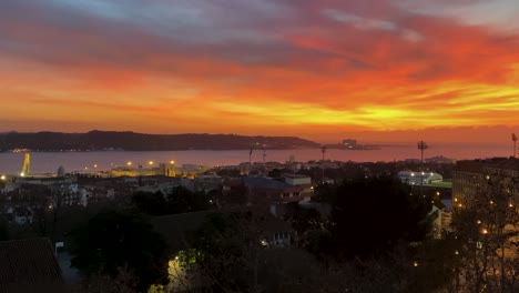 fabulous and dramatic bloody sunset over tagus river in lisbon