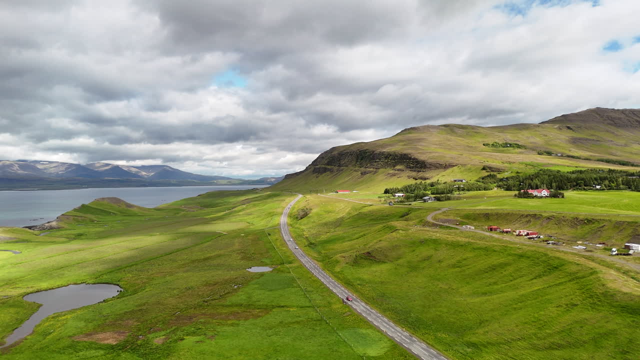Aerial view of Hvalfjörður fjord in Vesturland Iceland, showing calm waters, surrounding mountains, and expansive Icelandic landscape from above