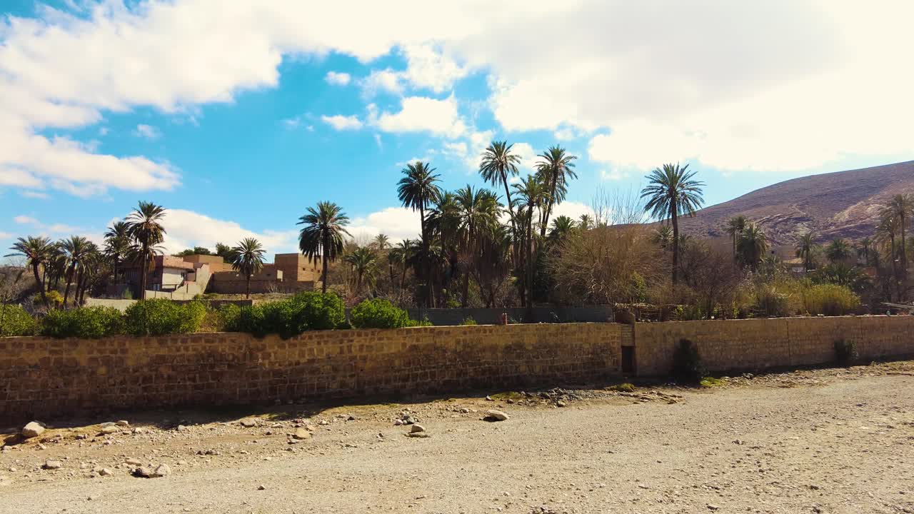 an old village in the middle of the desert with the style of Arab house