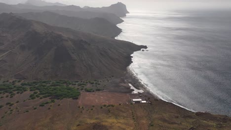 Aerial-View,-Coastline-of-Abandoned-Volcanic-Island,-Ocean-and-Landscape