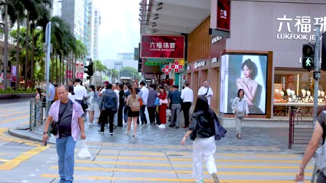 pedestrians crossing a bustling city intersection