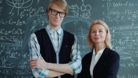 teacher and student in front of a chalkboard