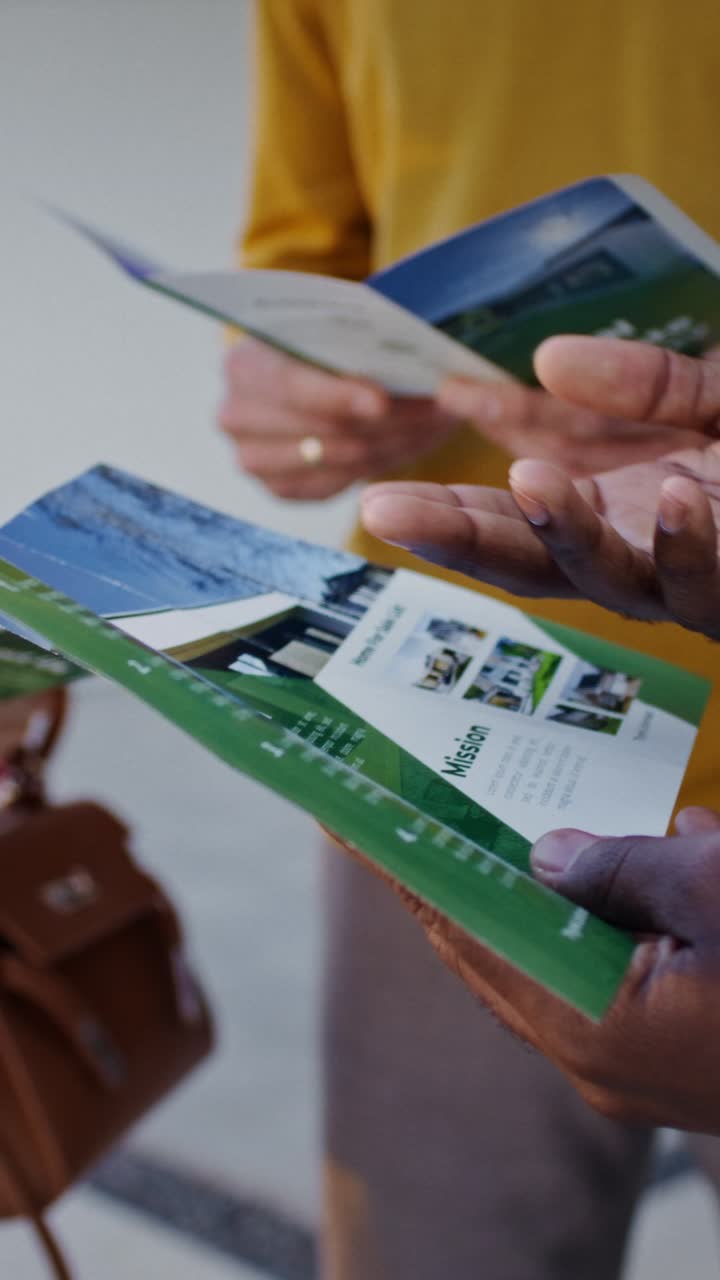 People Reviewing Real Estate Brochures