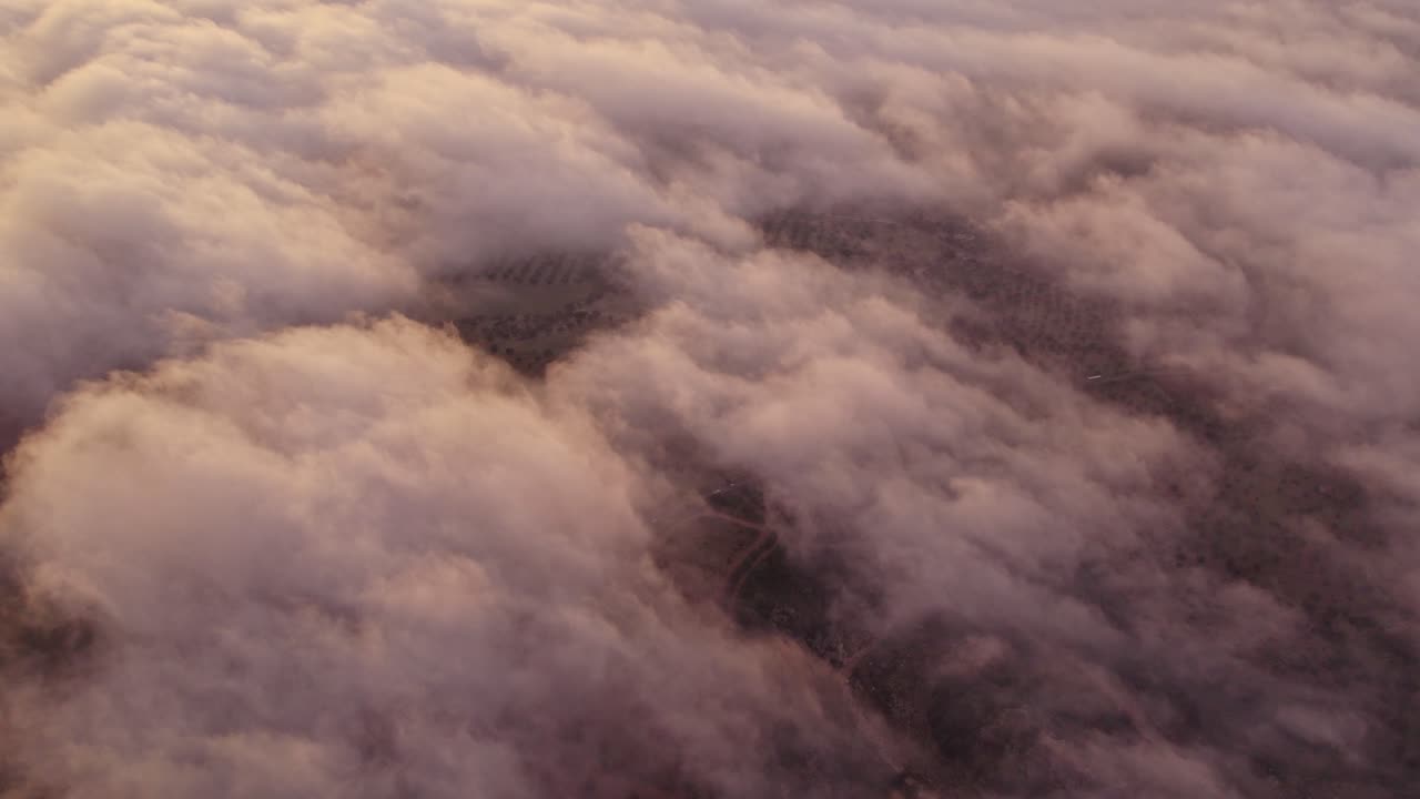 Rustic farmland at sunrise with rolling clouds, Ginosa, Taranto, Italy