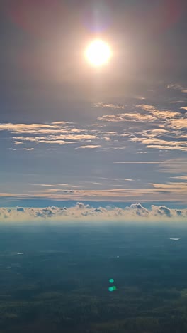 sun rising timelapse, aerial above nimbostratus clouds moving high altitude drone vertical video
