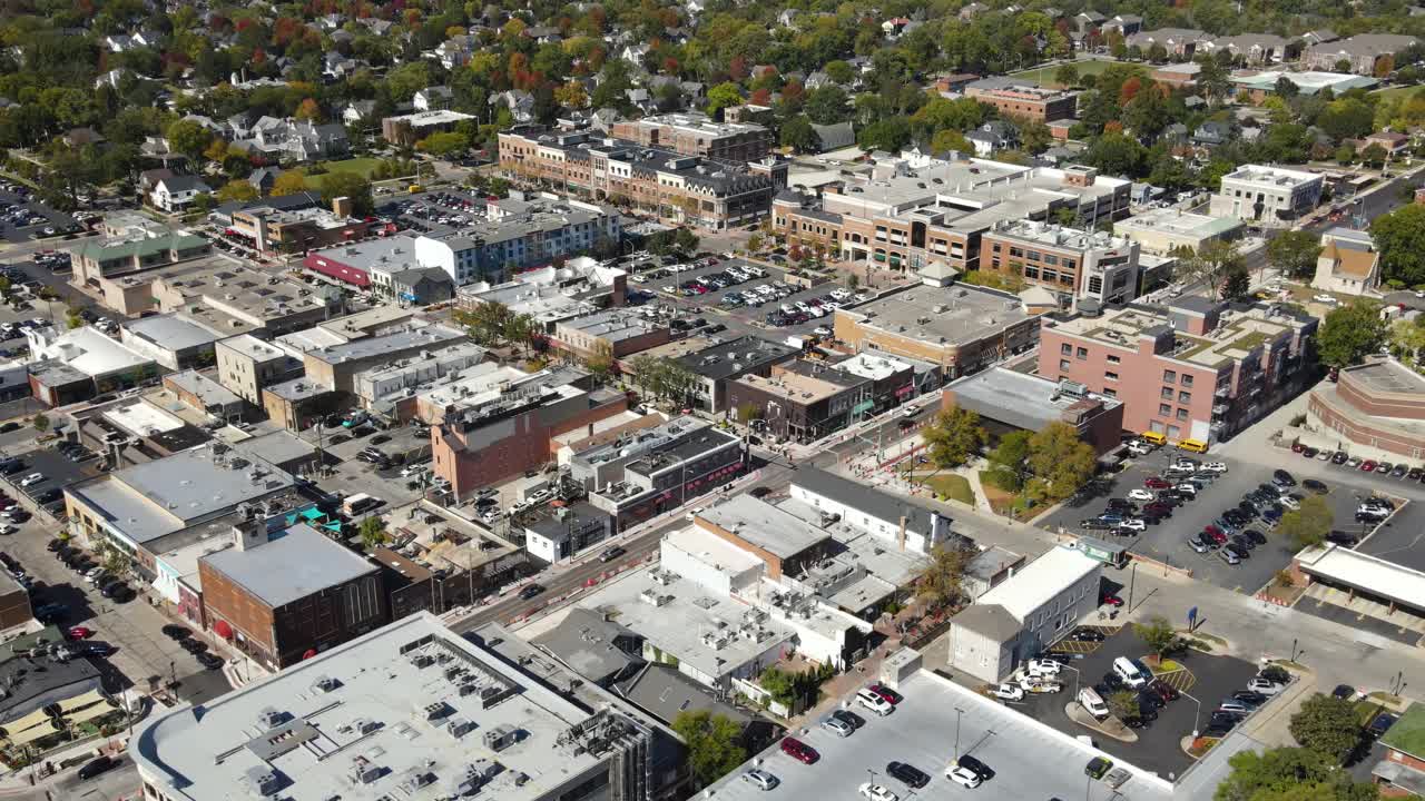 Naperville, IL, a Chicago suburb, on a sunny fall day, featuring buildings, streets. Crane Up Left Zoom Day NW