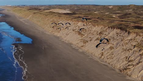 paragliding over the beach and dunes