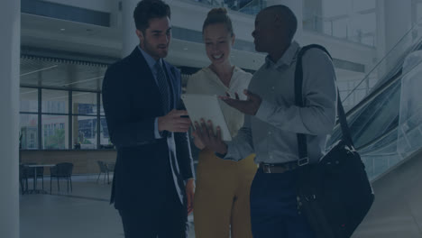 animation of financial data and graphs over diverse businesspeople talking