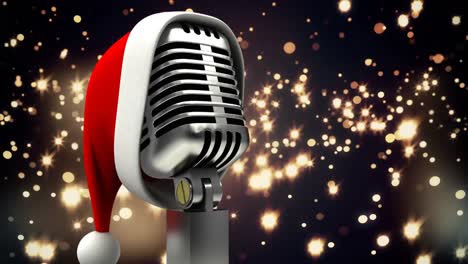 Animation-of-glowing-gold-lights-over-microphone-with-christmas-hat-on-dark-background