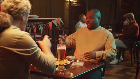 Man-Meeting-His-Friend-In-Pub