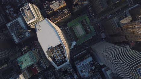 Aerial-birds-eye-overhead-top-down-view-of-office-or-apartment-buildings-in-city-centre.-Fly-over-modern-high-rise-towers.-Manhattan,-New-York-City,-USA