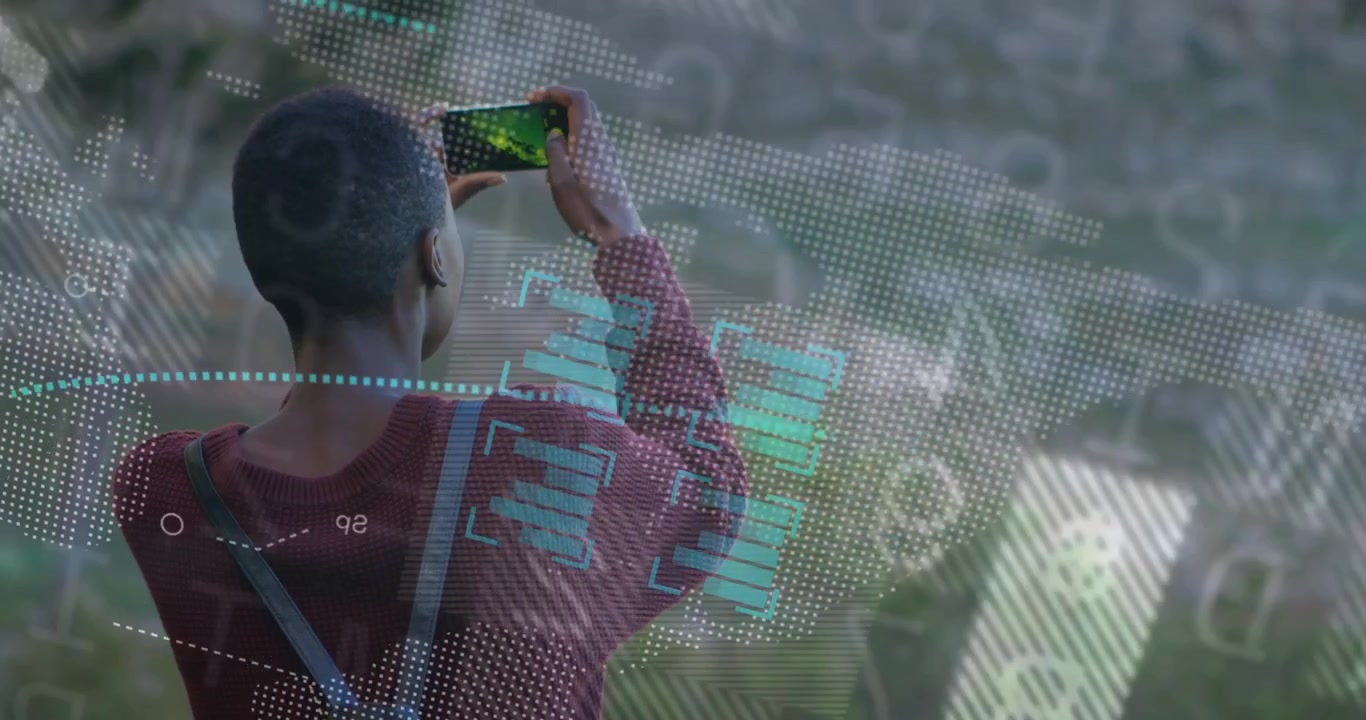 Woman raising smartphone capturing augmented reality data overlays on hillside during tech testing