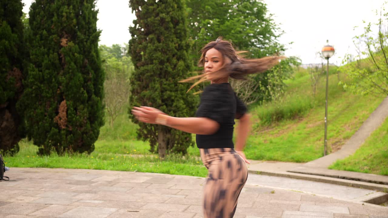 Woman dancing in a park