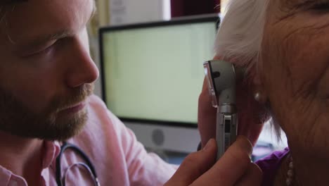 doctor examining a senior woman in a retirement home