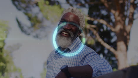 senior man checking smartwatch data in garden, displaying animated health icons and chart
