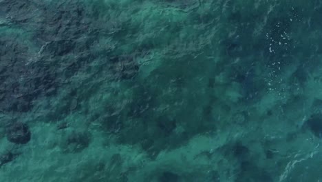 Top-Down-Aerial-View-of-Gentle-Ocean-Ripples