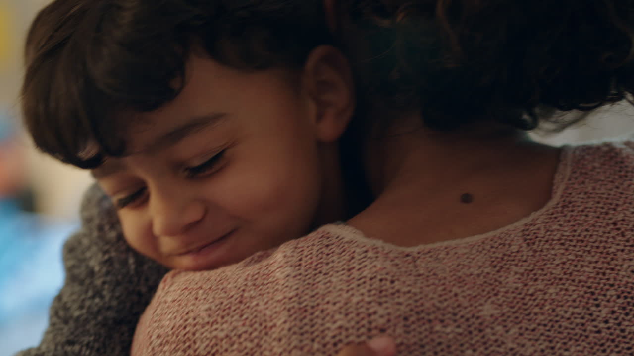happy little boy hugging mother enjoying loving mom embracing son at home 4k footage