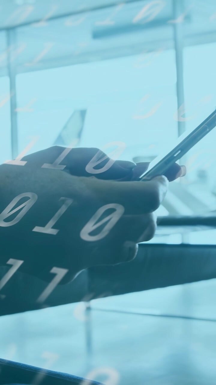 Vertical video: Hands lifting phone from armrest as digits sweep, thumbs swiping flight info window