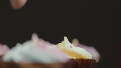 close up shot of cupcakes orbiting around a central cupcake