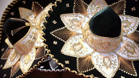 close up of a couple traditional mexican sombrero with golden color designs