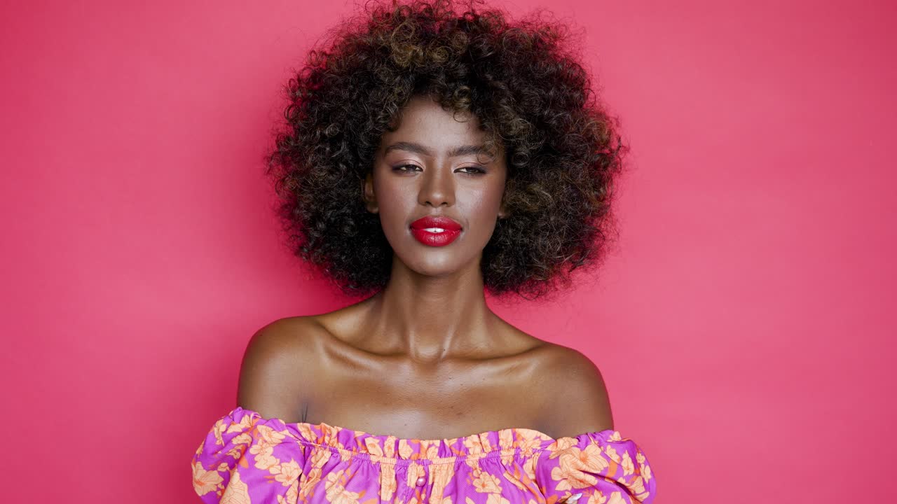 Stylish African American Woman in Floral Print Off-the-Shoulder Top