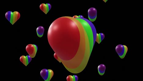 animación de corazones arco iris moviéndose sobre un fondo negro.