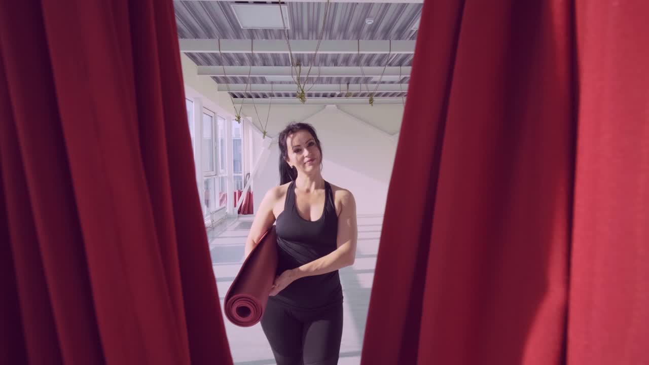 Aerial Fitness Journey: A Dancer's Graceful Transition Through Drapes in a Bright Studio, Emphasizing Strength, Flexibility, and Passion for Movement