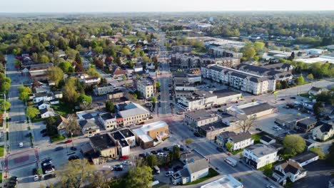 aerial flyover of a small suburban town in summer