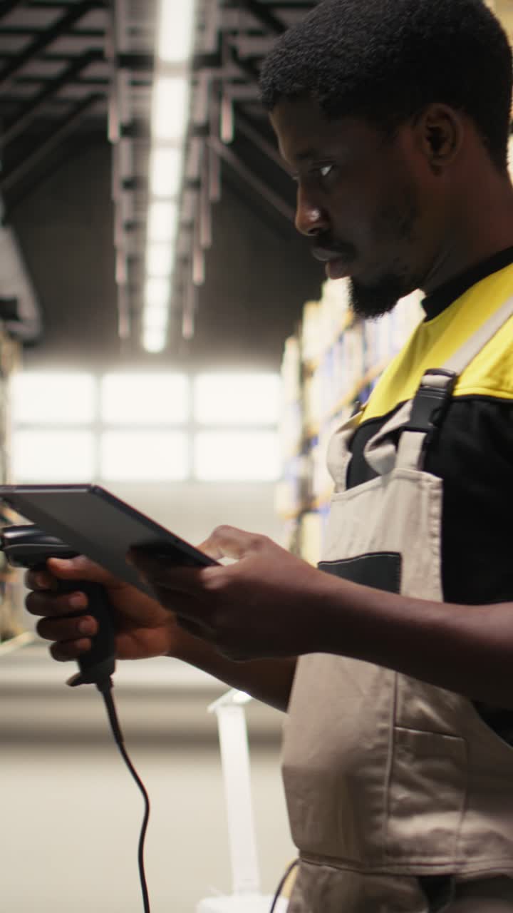 Vertical Video African american e-commerce worker scanning shipping labels numbers