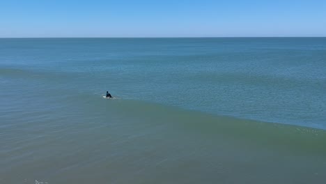 aerial footage from three surfers in villa gesell