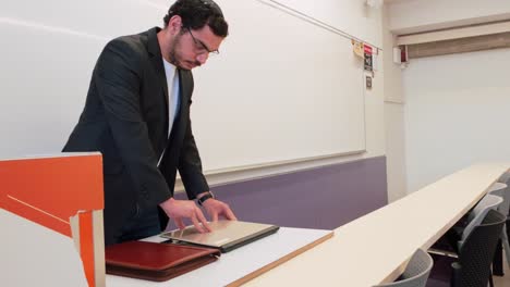 university professor enters lecture room