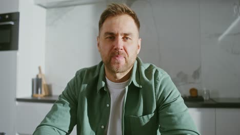 man talking in a kitchen