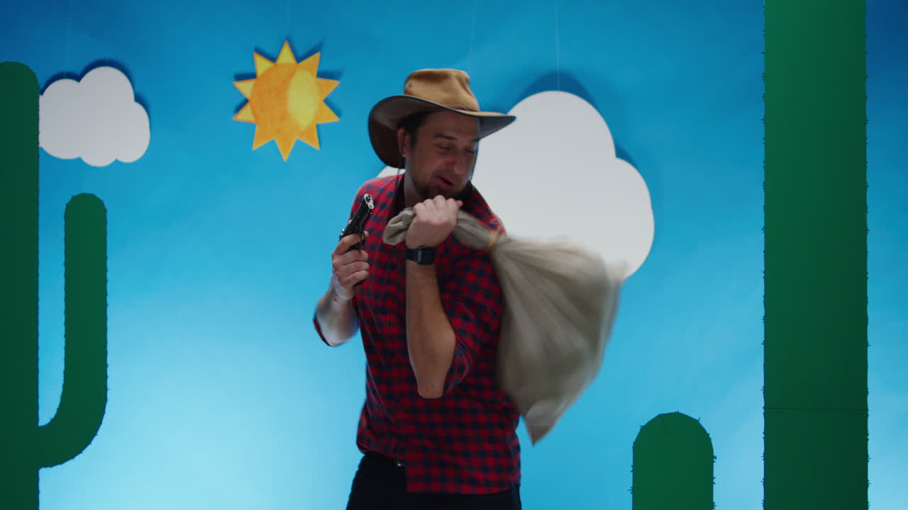 Cowboy with Bag and Gun in Desert Scene