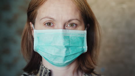 Portrait-Of-A-Young-Woman-In-A-Medical-Mask