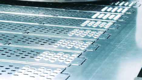 holes in metal sheet after stamping by press. modern metalworking technology