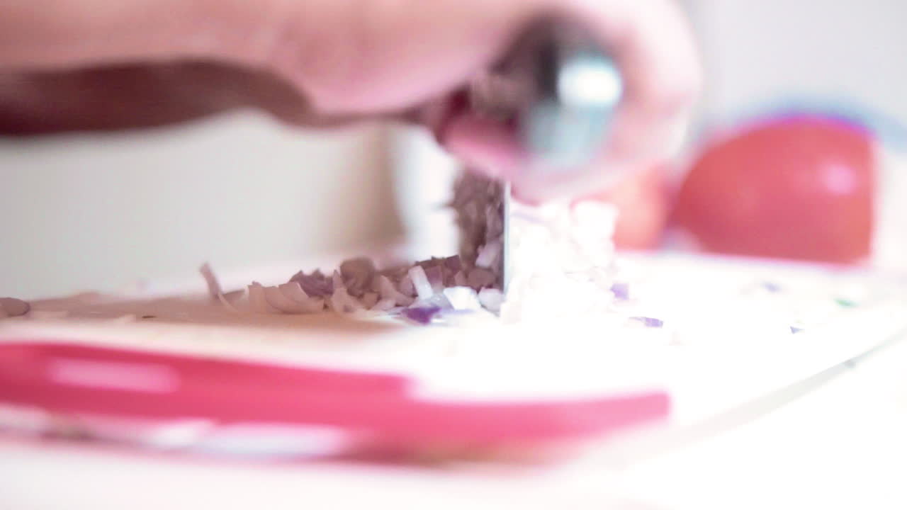 Onions being finely chopped for cooking