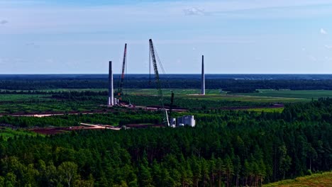 wind turbine farm building site under construction renewable green energy, aerial drone