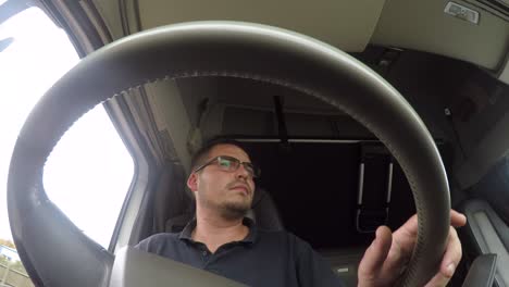 in cab action cam view of a male hgv driver