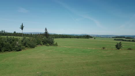 a caravan standing over a green landscape