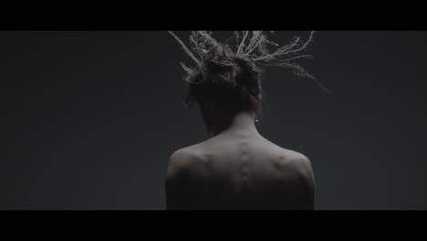 a woman dressed as mother nature rise slowly