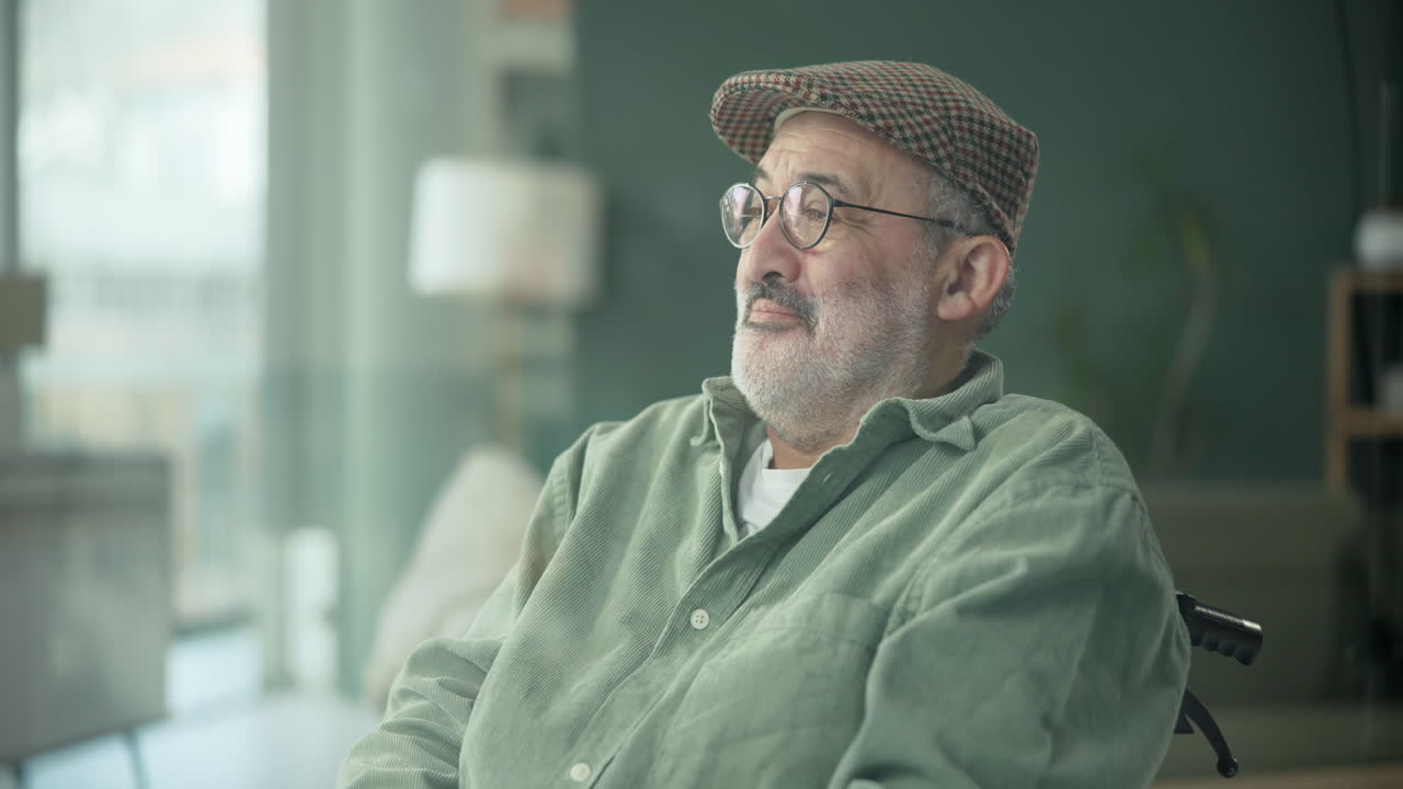 Elderly man in wheelchair at home