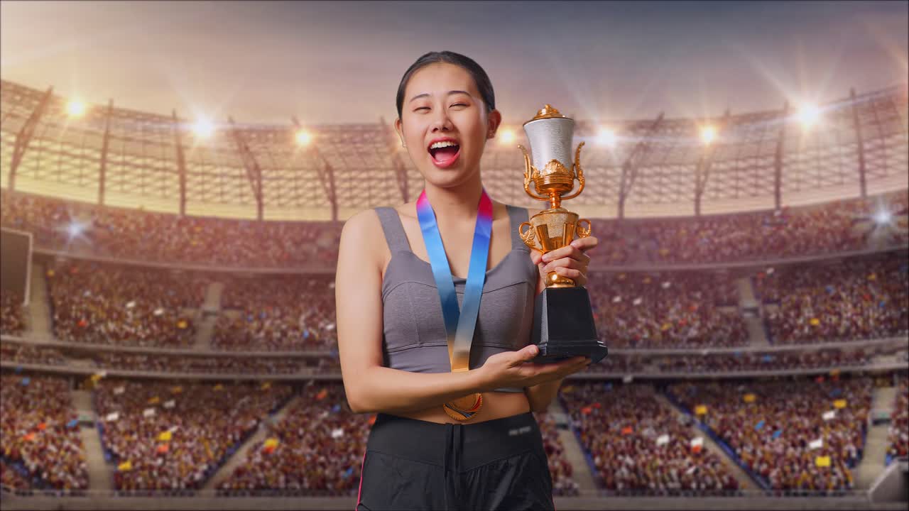 Asian Woman With A Gold Medal Kissing A Gold Trophy Being Proud Winning As The First Winner At The Stadium