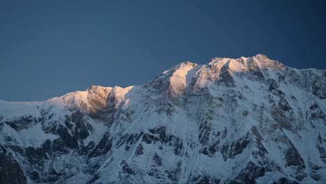 Winter-Mountain-Ridge-Background-with-Copy-Space,-Snowy-Snowcapped-Mountain-Ridge-Landscape-with-Snow-in-Minimalist-Nature-Background-at-Dusk-in-Beautiful-Last-Light-Sunlight-at-Sunset