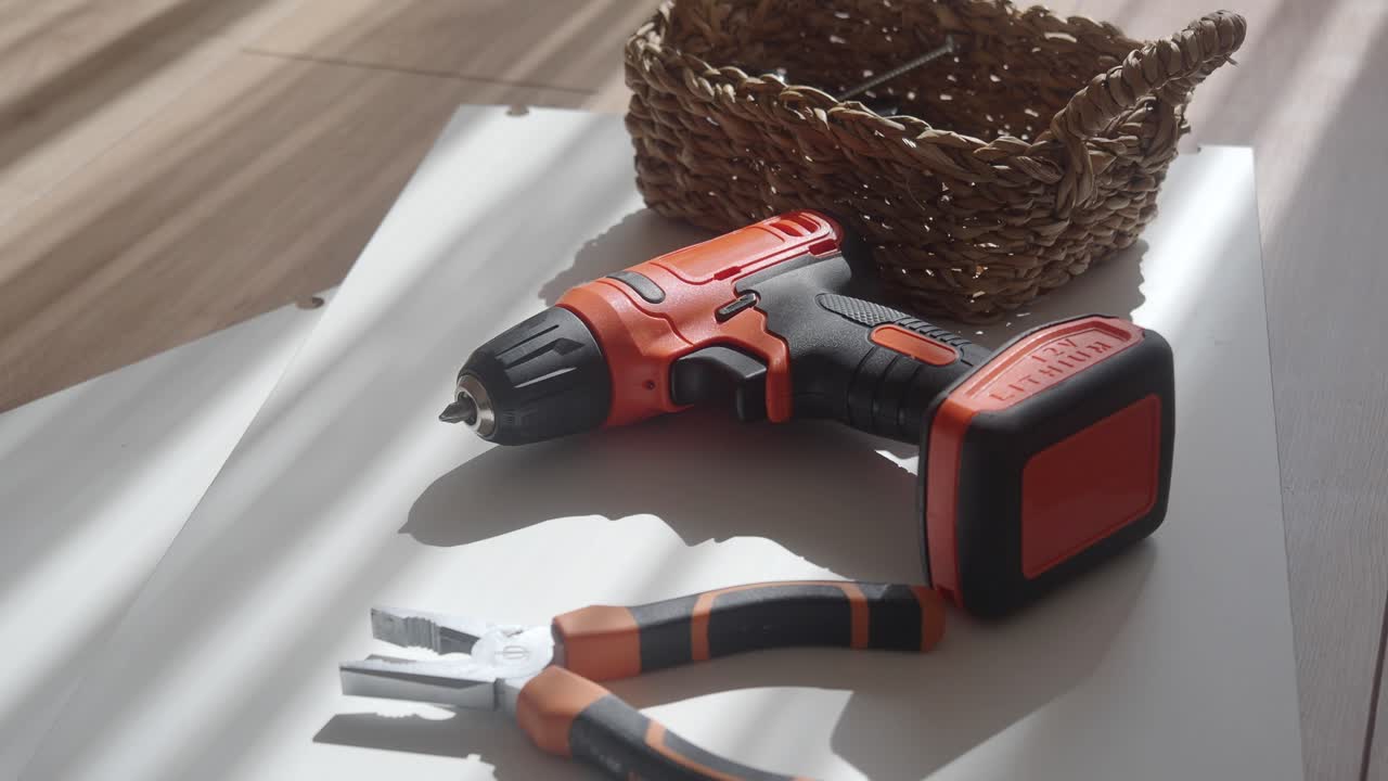 Tools and basket on a white surface