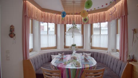 dining table in the kitchen nooks with party food, decorations set up in the house