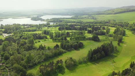 aerial angle of pan around lochore meadows golf course in fife, scotland