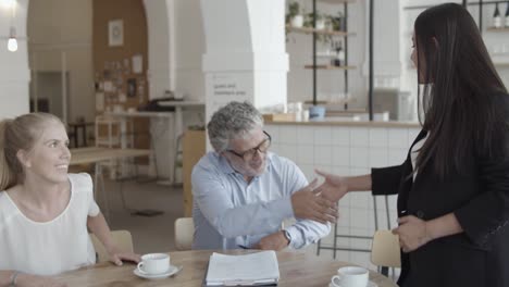 insurance agent and customers meeting at co-working