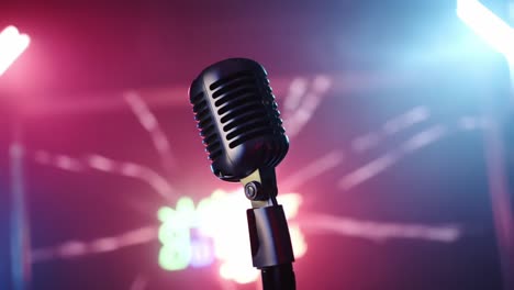 a retro microphone captured in stunning colorful lighting, highlighting the vibrant atmosphere of live performances and musical events